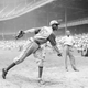 In this Aug. 2, 1942, file photo, Kansas City Monarchs pitcher Leroy Satchel Paige warms up at New York’s Yankee Stadium before a Negro League game between the Monarchs and the New York Cuban Stars.